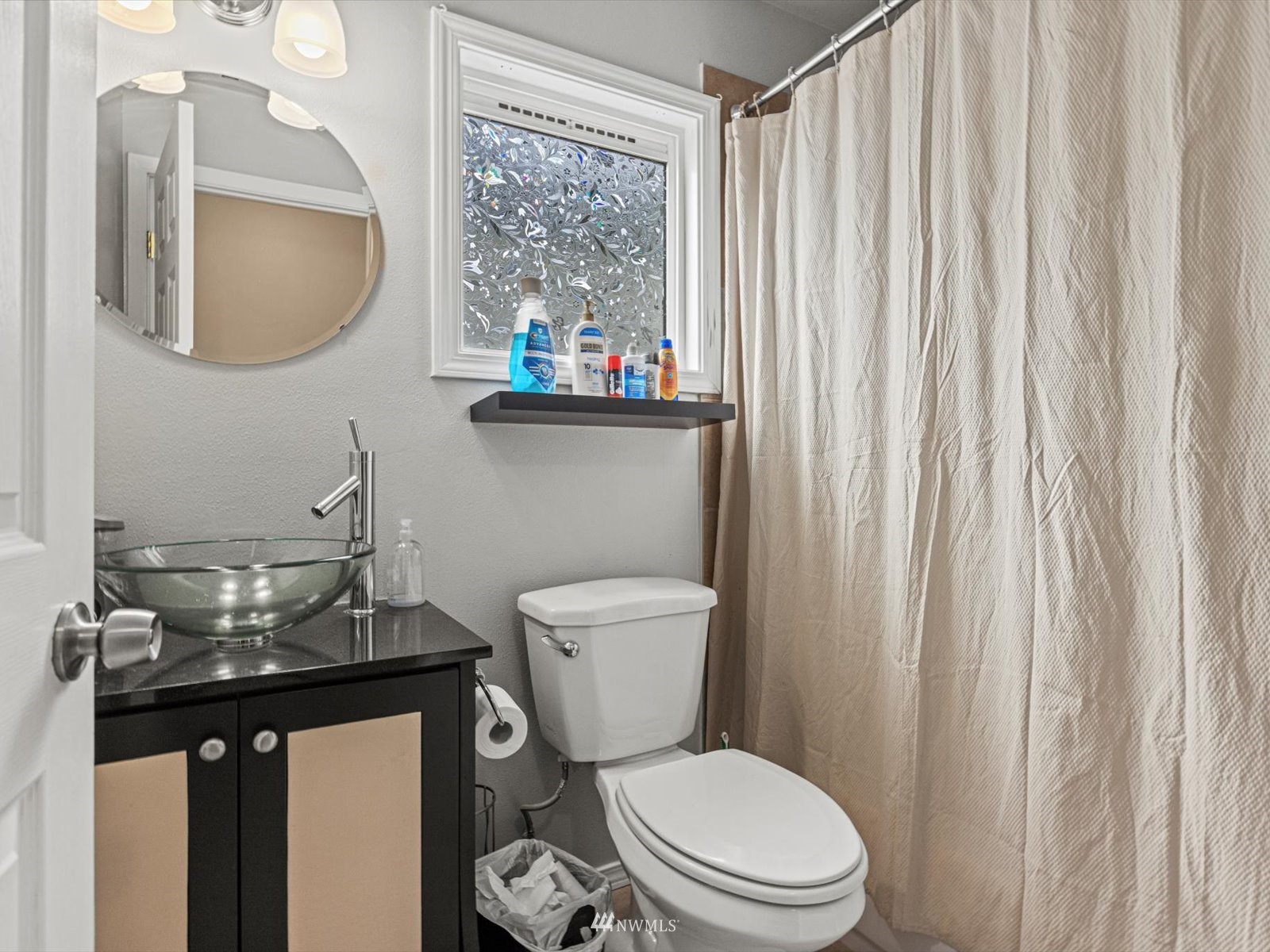 430 Southwest 4th Place Renton, WA 98057 - Photo 15 of 29 a bathroom with a toilet a sink and a mirror