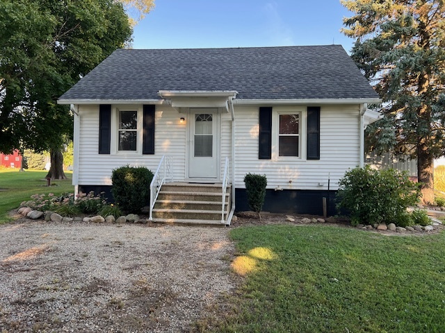 7375 Coon Trail Road Capron, IL 61012 - Photo 1 of 14 a front view of a house with garden
