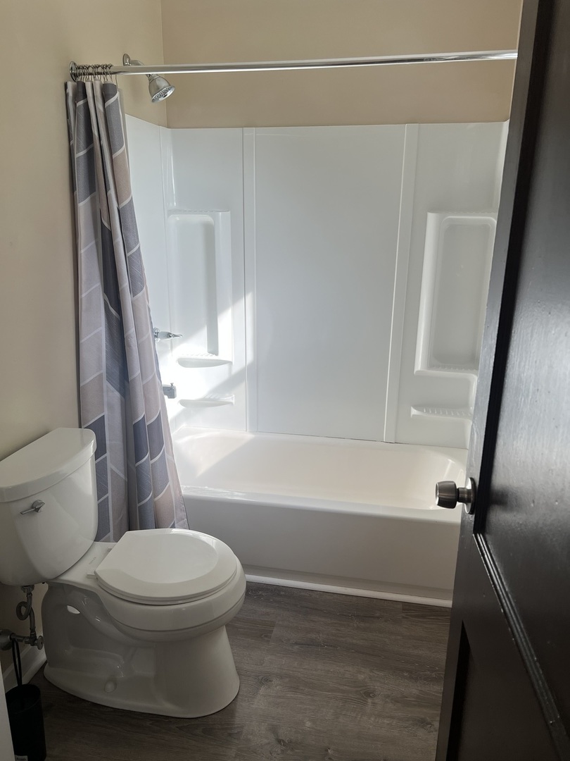 7375 Coon Trail Road Capron, IL 61012 - Photo 11 of 14 a bathroom with a toilet and a shower