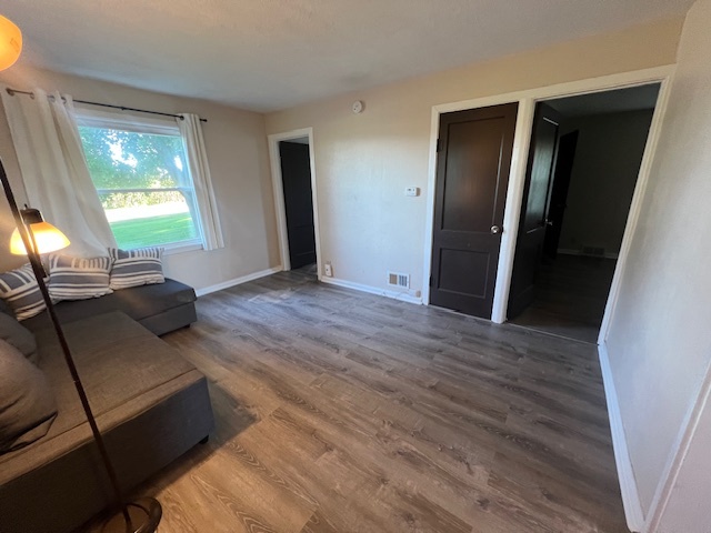 7375 Coon Trail Road Capron, IL 61012 - Photo 6 of 14 a living room with furniture and a window