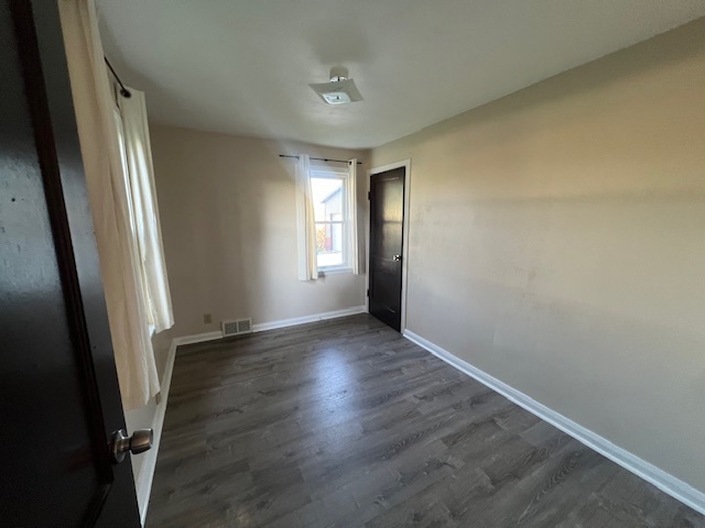 7375 Coon Trail Road Capron, IL 61012 - Photo 9 of 14 an empty room with wooden floor and windows