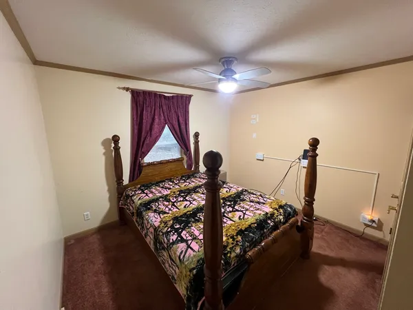 a bed room with furniture and a window