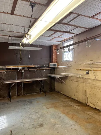 a view of a kitchen with a sink and cabinets