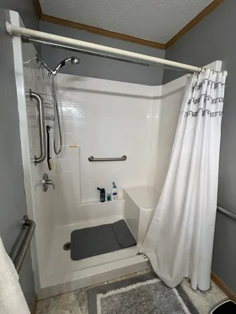 a bathroom with a shower and toilet