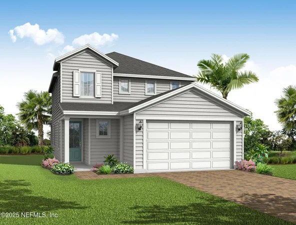 a front view of a house with a garden and yard