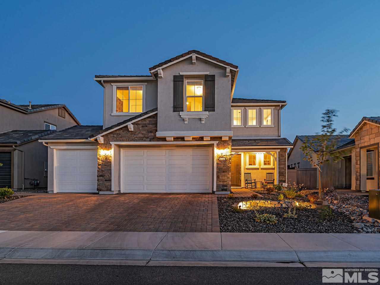 3110 Show Jumper Lane Reno, NV 89521 - Photo 1 of 28 a front view of a house with a yard and garage