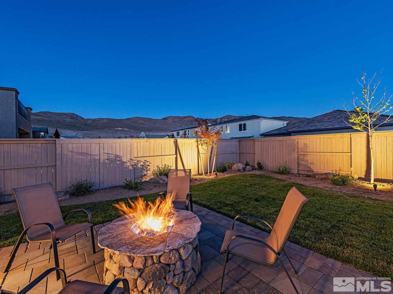 3110 Show Jumper Lane Reno, NV 89521 - Photo 18 of 28 a view of a chairs and table in backyard