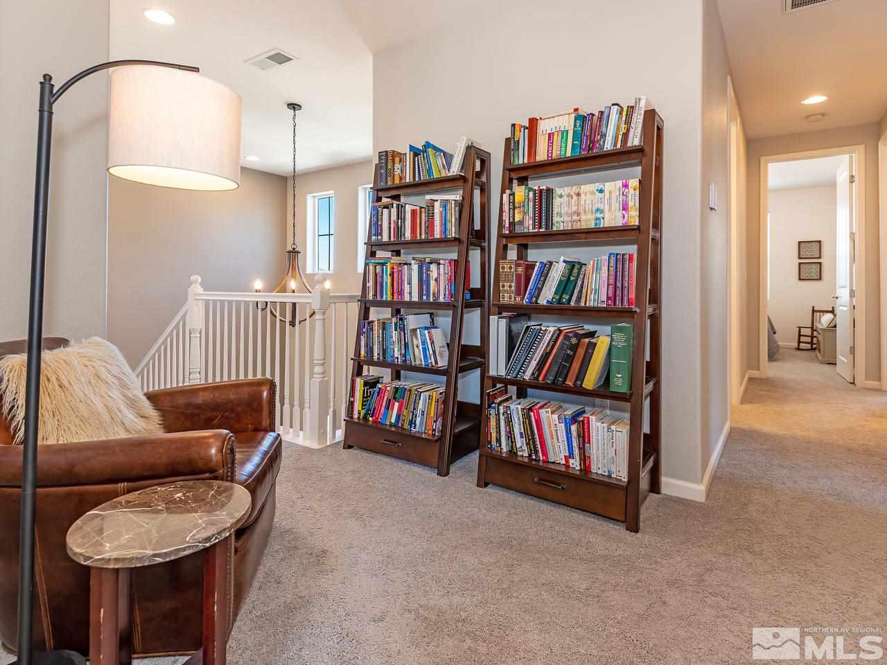 3110 Show Jumper Lane Reno, NV 89521 - Photo 20 of 28 a living room with furniture a book shelf and a book shelf