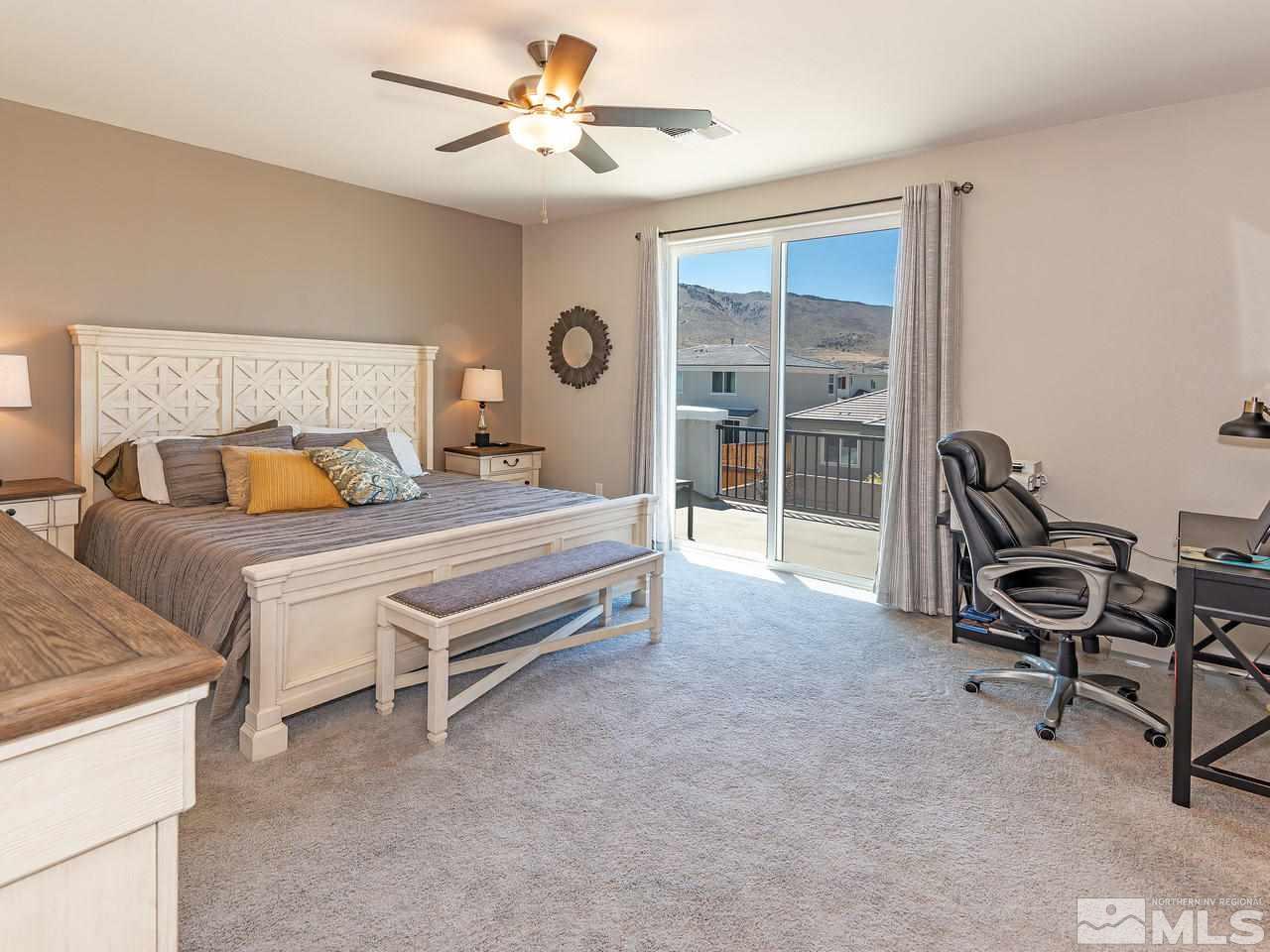 3110 Show Jumper Lane Reno, NV 89521 - Photo 21 of 28 a bedroom with furniture and a ceiling fan