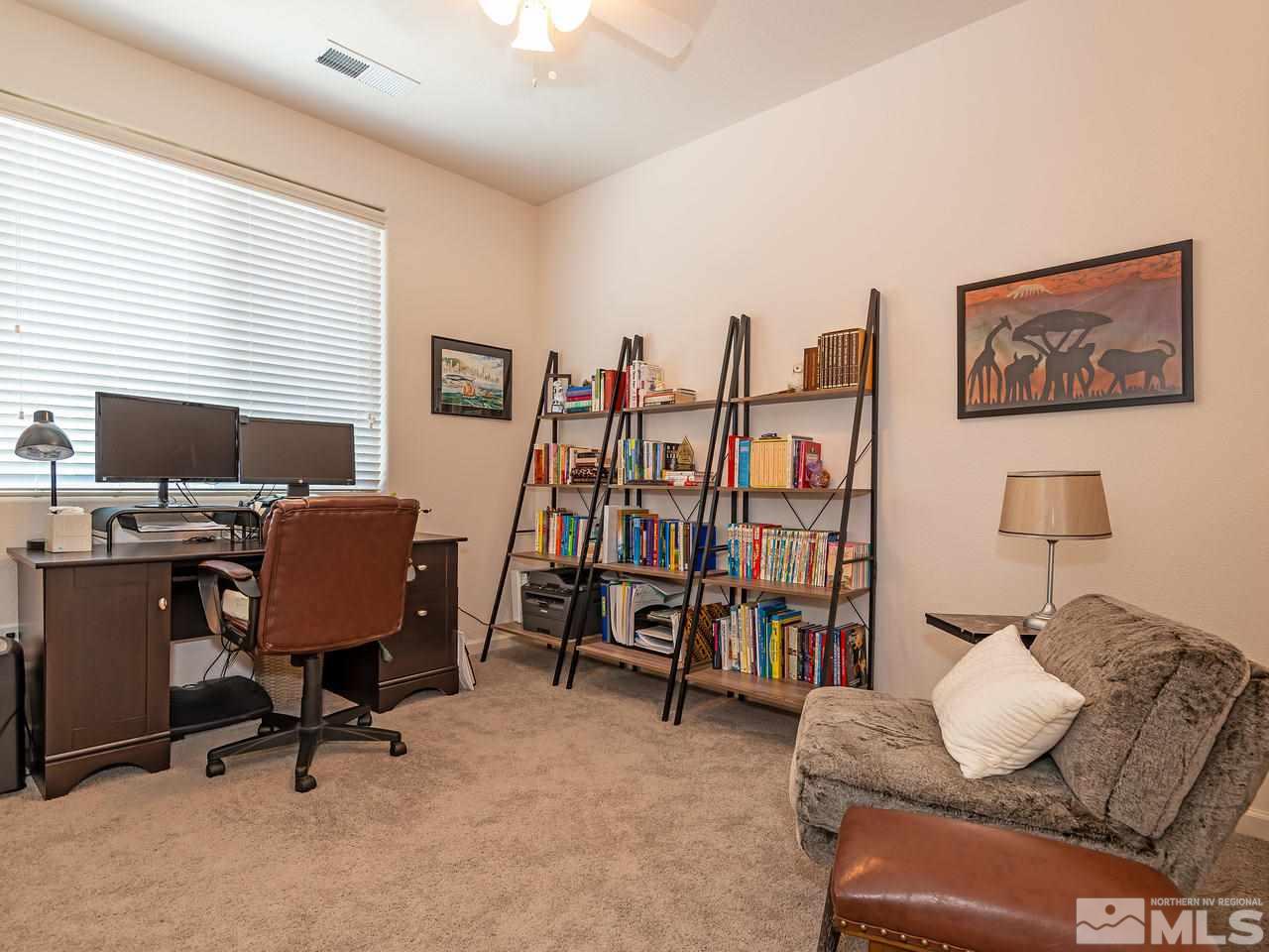 3110 Show Jumper Lane Reno, NV 89521 - Photo 26 of 28 a view of a livingroom with workspace and a couch
