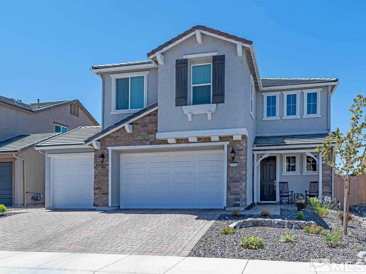 3110 Show Jumper Lane Reno, NV 89521 - Photo 28 of 28 a front view of a house with a yard and garage