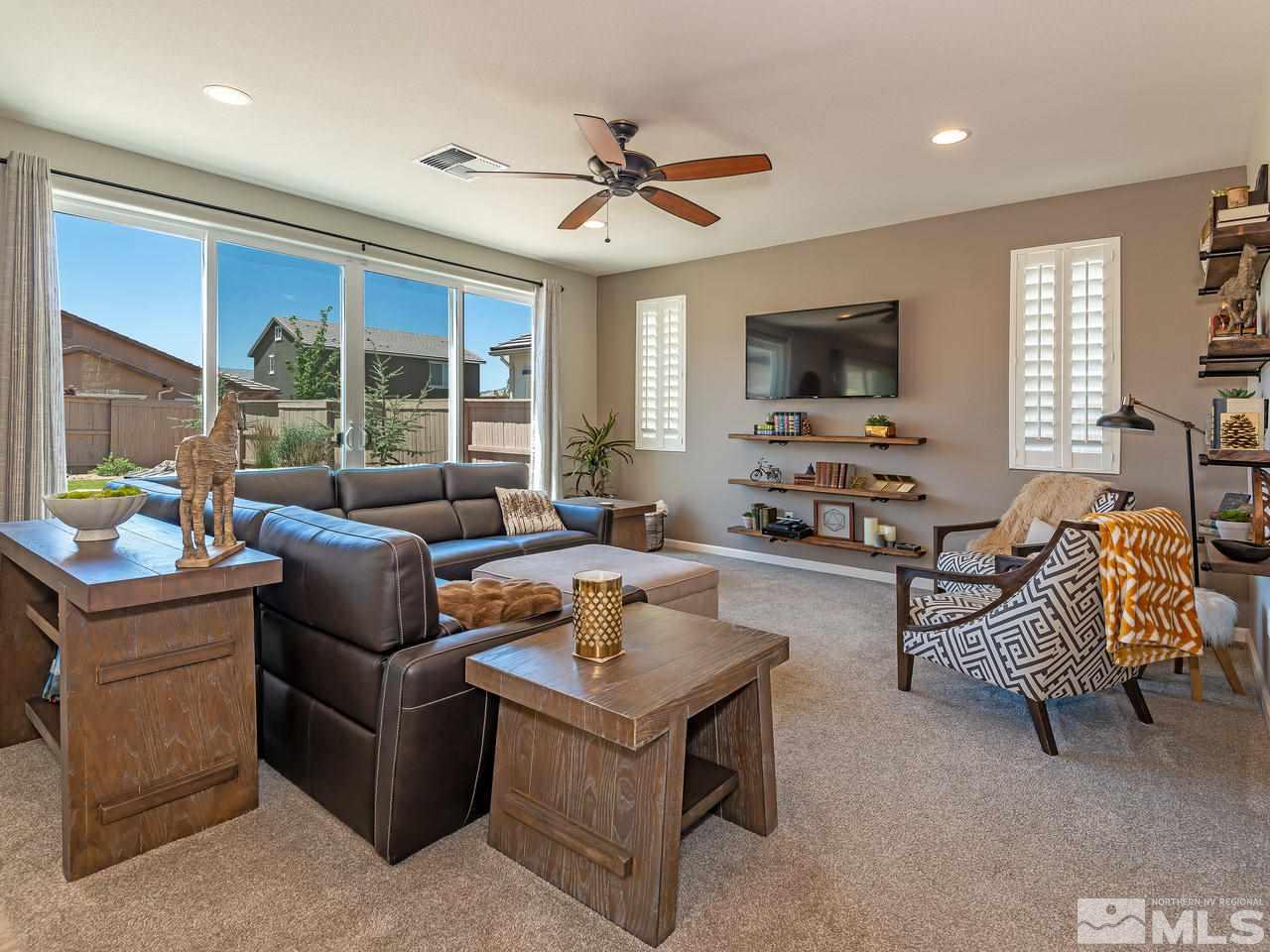 3110 Show Jumper Lane Reno, NV 89521 - Photo 4 of 28 a living room with furniture and a flat screen tv