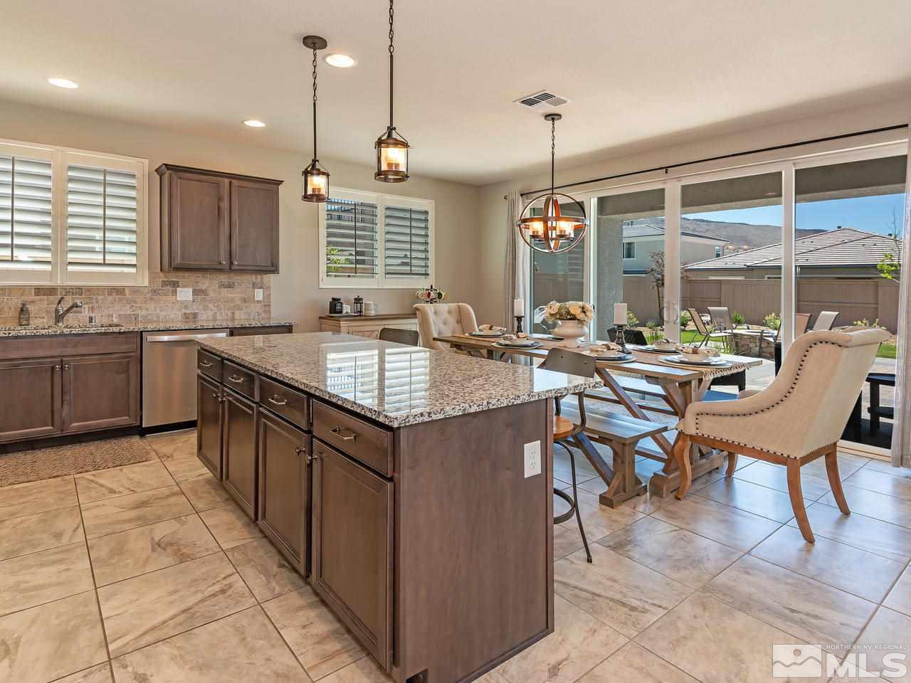 3110 Show Jumper Lane Reno, NV 89521 - Photo 9 of 28 a kitchen with center island table and chairs
