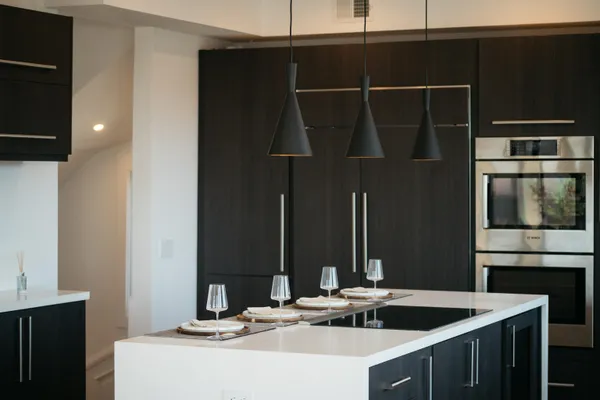 a kitchen with a sink and a refrigerator