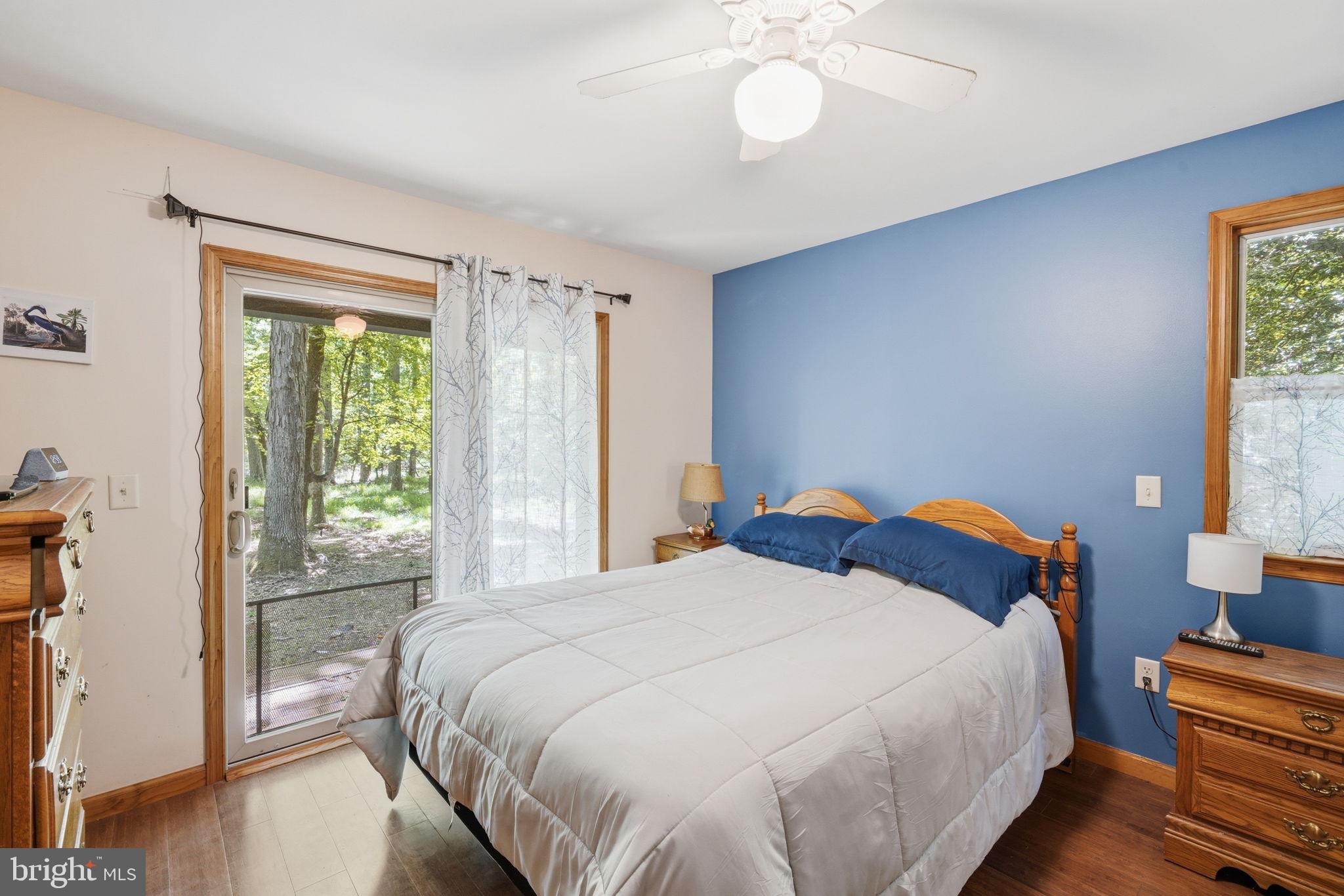 22300 Frazier Road Rock Hall, MD 21661 - Photo 15 of 38 a bedroom with a bed and a window