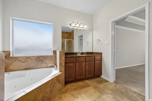 a bathroom with a bathtub and a sink
