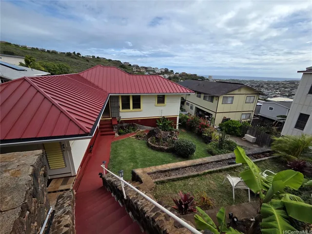 an outdoor space with furniture and city view