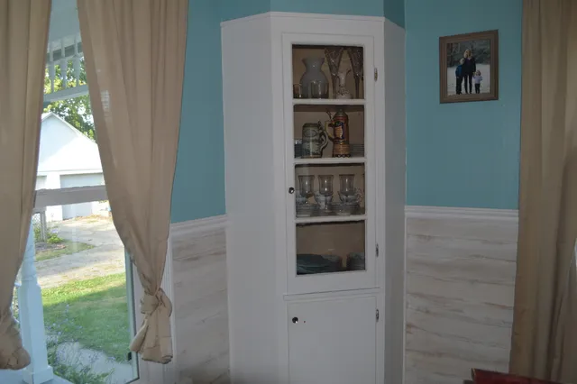a view of a bathroom with a bathtub and a window
