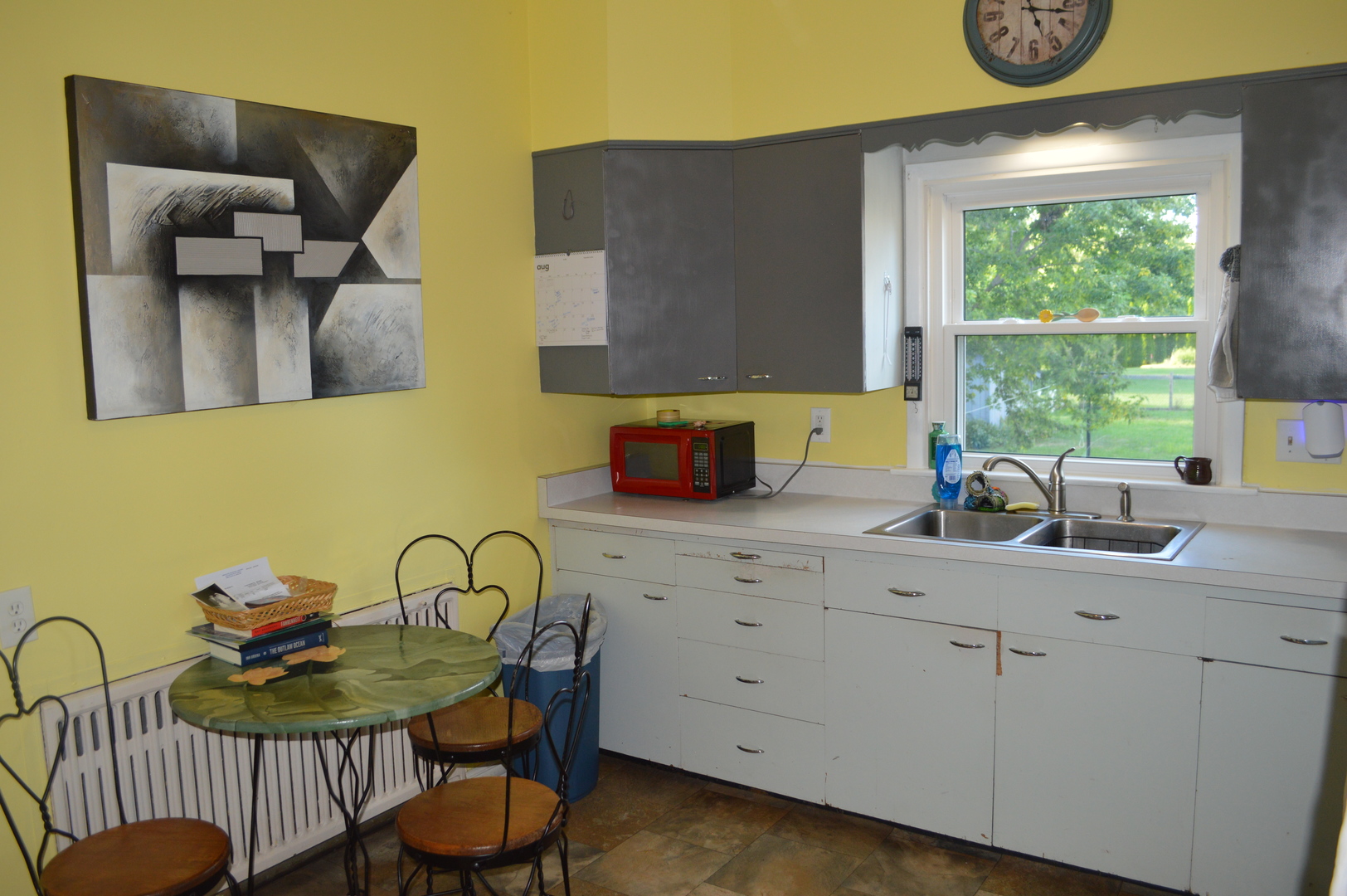 1007 West Farnham Street Princeton, IL 61356 - Photo 13 of 32 a kitchen with a table chairs and a window