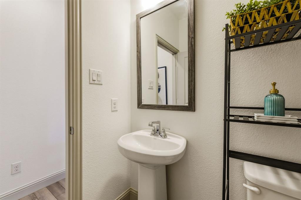 3720 Dutchess Drive Frisco, TX 75034 - Photo 17 of 36 a bathroom with a sink and a mirror