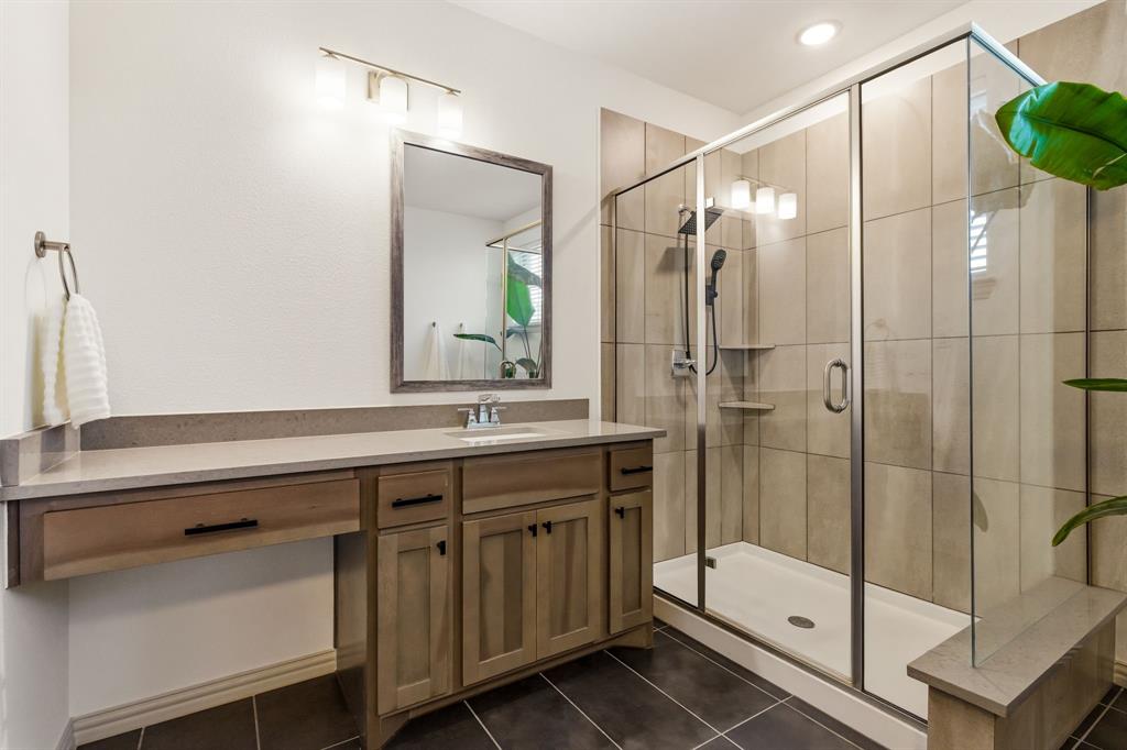 3720 Dutchess Drive Frisco, TX 75034 - Photo 21 of 36 a bathroom with a shower sink and mirror