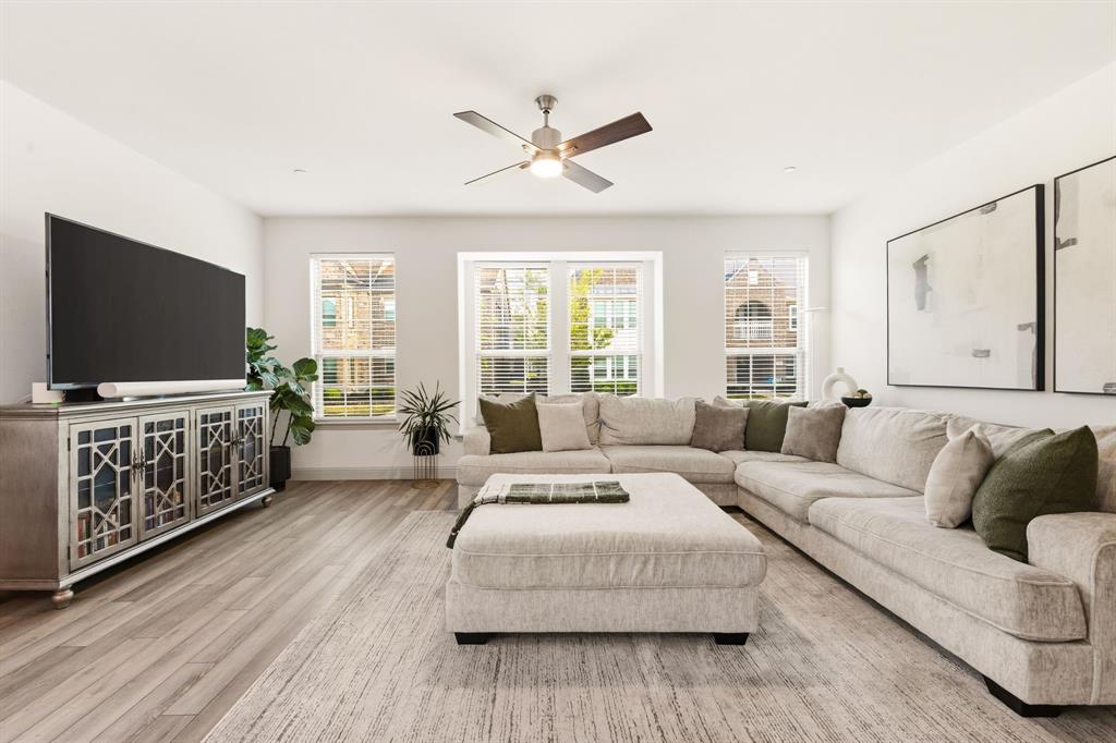 3720 Dutchess Drive Frisco, TX 75034 - Photo 4 of 36 a living room with furniture and a flat screen tv