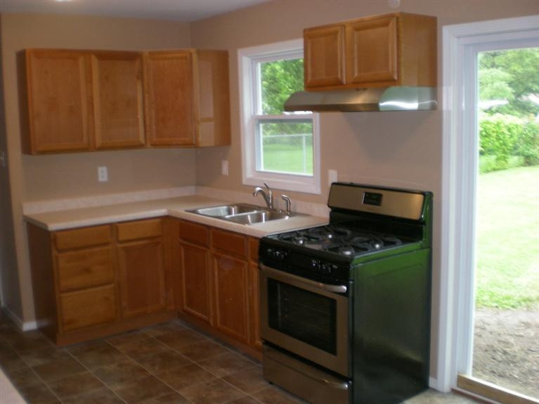 725-1 Governor Road Valparaiso, IN 46385 - Photo 8 of 10 a kitchen with a stove and a sink