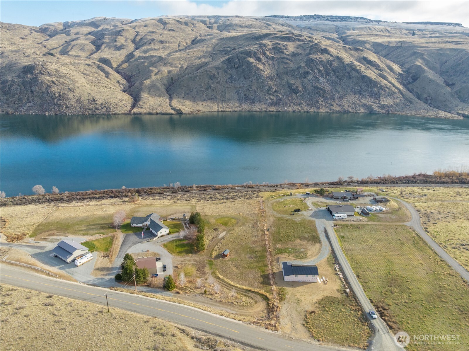 150 Starr Road Pateros, WA 98846 - Photo 19 of 40 an aerial view of residential houses with outdoor space and lake view