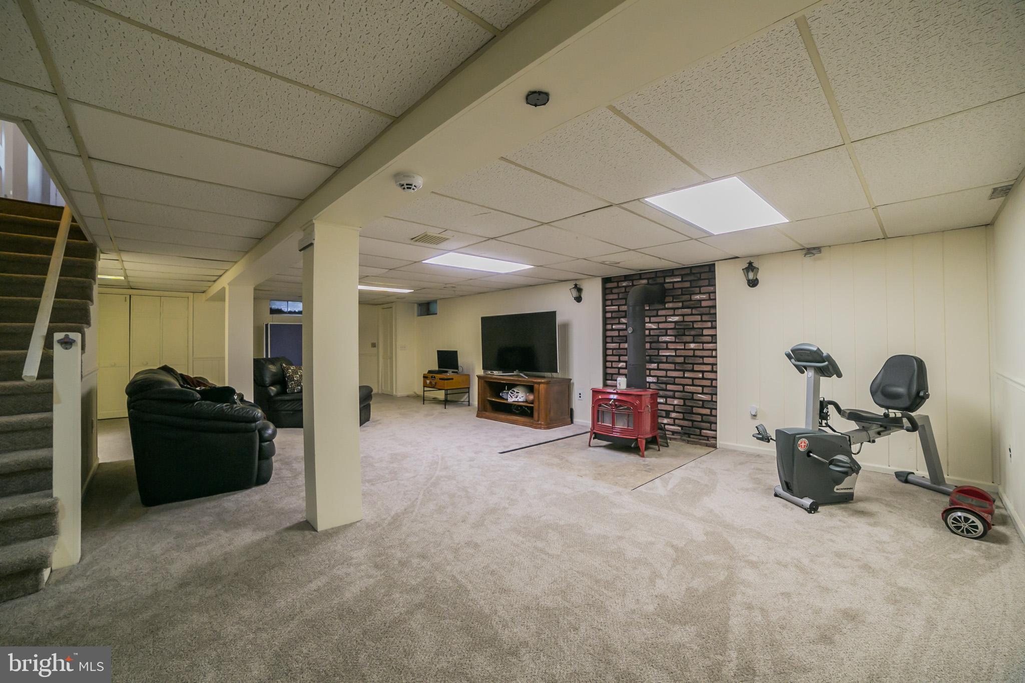 515 Country Club Road Phoenixville, PA 19460 - Photo 24 of 30 Basement with wood burning stove