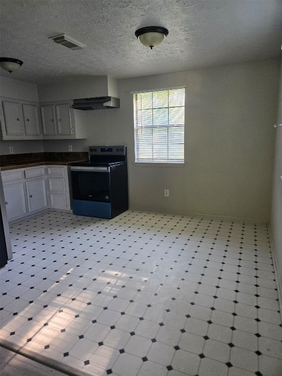 19639 Maple Lane New Caney, TX 77357 - Photo 11 of 18 a room with a black white checkered floor