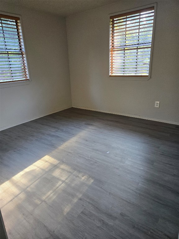 19639 Maple Lane New Caney, TX 77357 - Photo 13 of 18 an empty room with wooden floor and windows