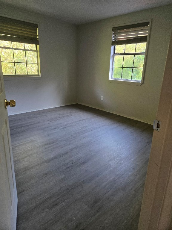 19639 Maple Lane New Caney, TX 77357 - Photo 14 of 18 an empty room with wooden floor and windows