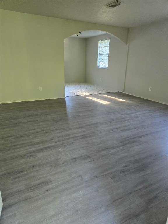 19639 Maple Lane New Caney, TX 77357 - Photo 9 of 18 a view of an empty room with wooden floor and a window