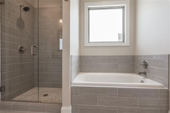 657 Jackson Road Portland, TN 37148 - Photo 15 of 30 a white bath tub sitting next to a shower