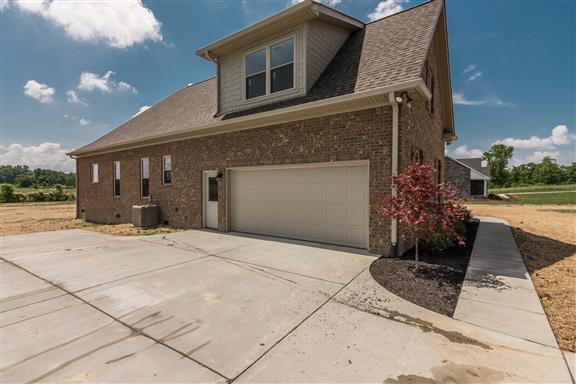 657 Jackson Road Portland, TN 37148 - Photo 3 of 30 a front view of a house with a yard