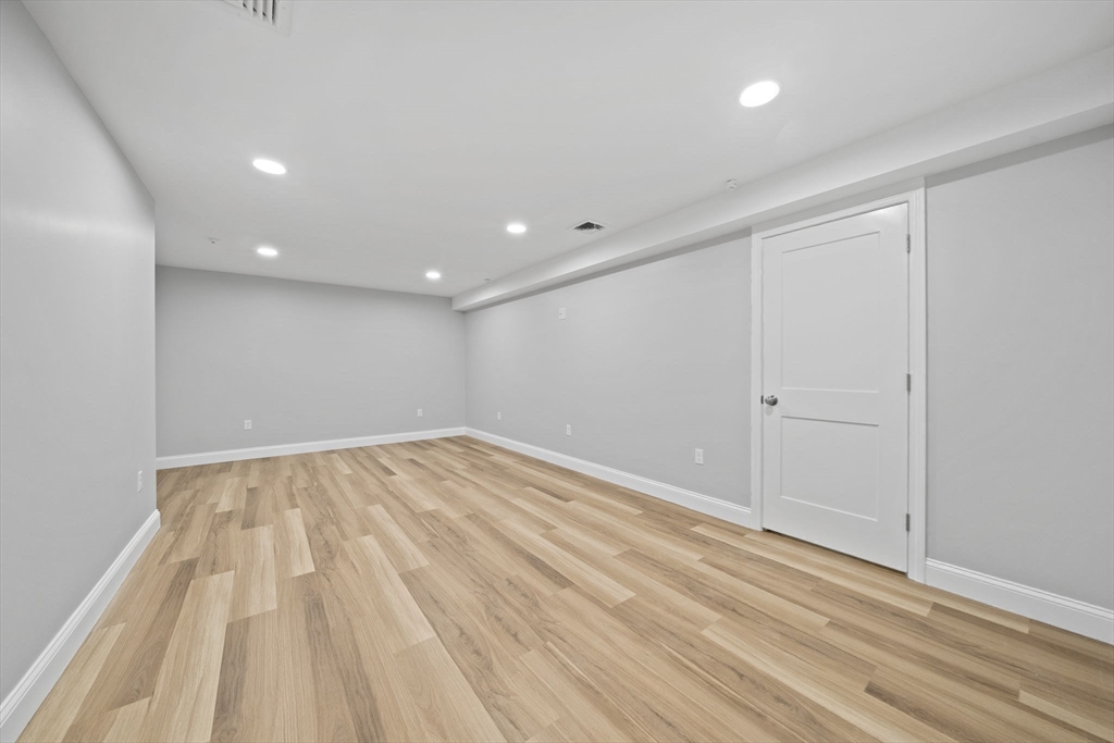 6 Simmonds Boulevard, Unit 6 Randolph, MA 02368 - Photo 20 of 28 a view of empty room with wooden floor