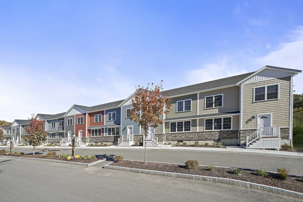 6 Simmonds Boulevard, Unit 6 Randolph, MA 02368 - Photo 2 of 28 a front view of a building with street view