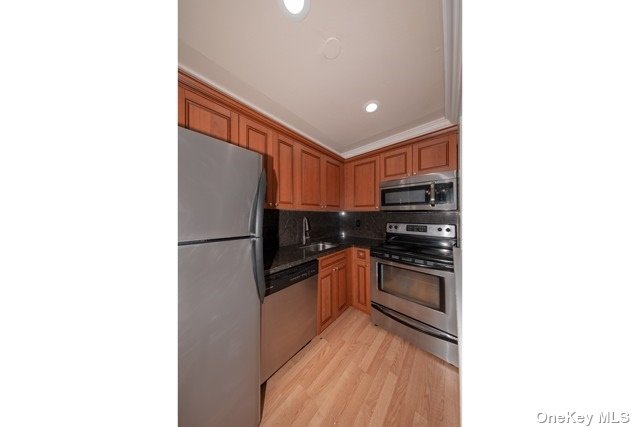 100 Middleton Road, Unit MA19 Bohemia, NY 11716 - Photo 1 of 1 a kitchen with stainless steel appliances granite countertop a refrigerator and a stove