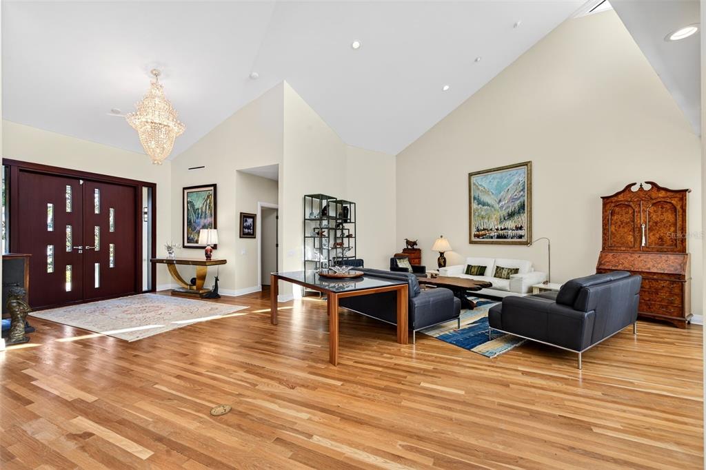 1571 Harbor Cay Lane Longboat Key, FL 34228 - Photo 21 of 93 a living room with furniture and wooden floor