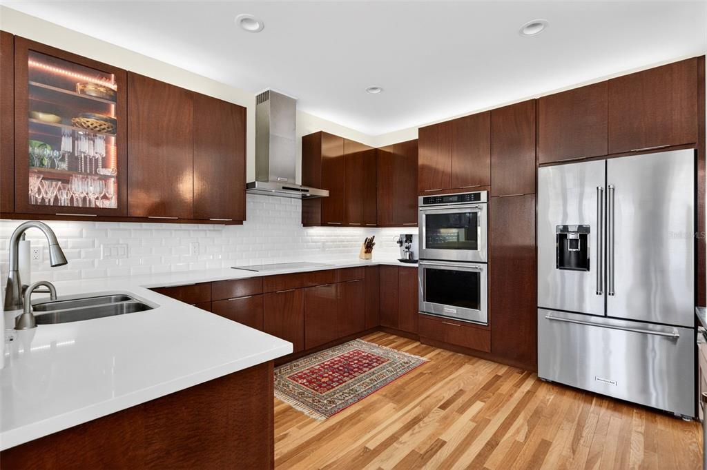 1571 Harbor Cay Lane Longboat Key, FL 34228 - Photo 25 of 93 a kitchen with stainless steel appliances a refrigerator sink and stove