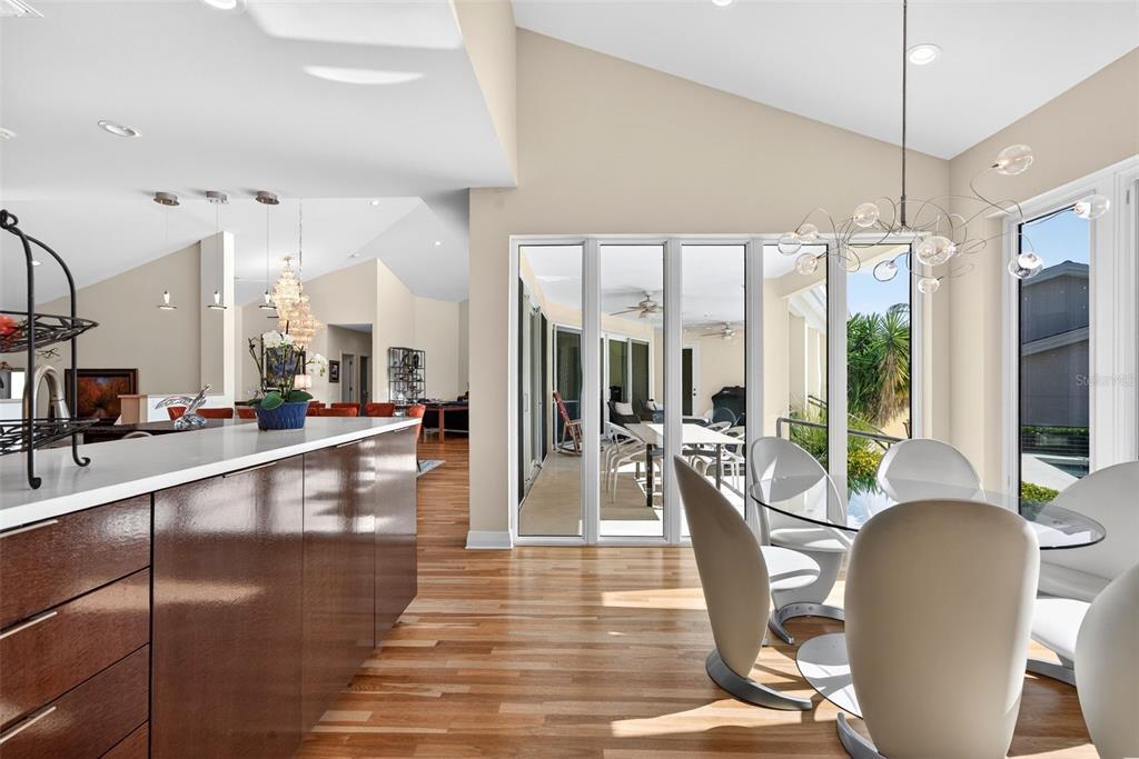 1571 Harbor Cay Lane Longboat Key, FL 34228 - Photo 30 of 93 a view of a dining room with furniture window and wooden floor