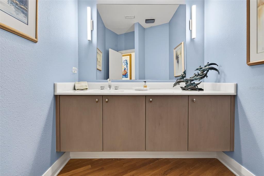 1571 Harbor Cay Lane Longboat Key, FL 34228 - Photo 36 of 93 a bathroom with a sink and a mirror