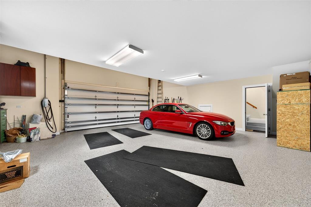 1571 Harbor Cay Lane Longboat Key, FL 34228 - Photo 45 of 93 a view of parking garage with cars parked