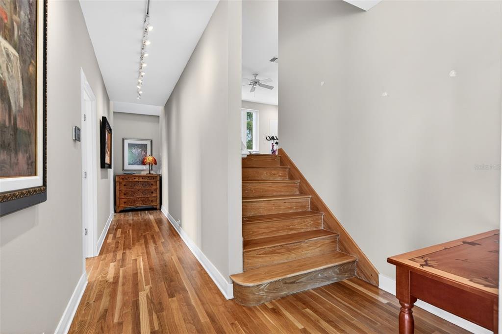 1571 Harbor Cay Lane Longboat Key, FL 34228 - Photo 47 of 93 a view of a hallway with wooden floor and staircase