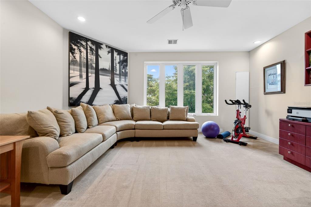 1571 Harbor Cay Lane Longboat Key, FL 34228 - Photo 49 of 93 a living room with furniture and a large window