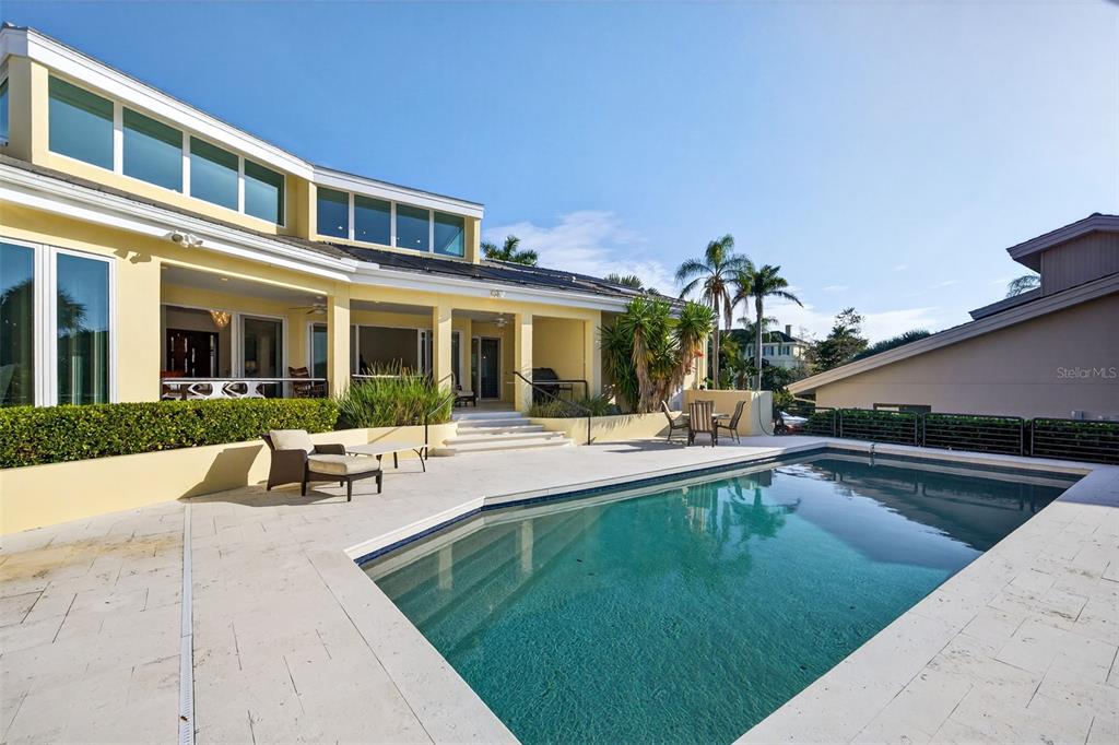 1571 Harbor Cay Lane Longboat Key, FL 34228 - Photo 57 of 93 a swimming pool with outdoor seating and yard