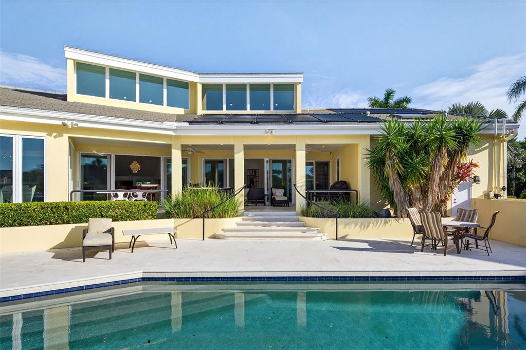 1571 Harbor Cay Lane Longboat Key, FL 34228 - Photo 58 of 93 a view of house with outdoor space and porch