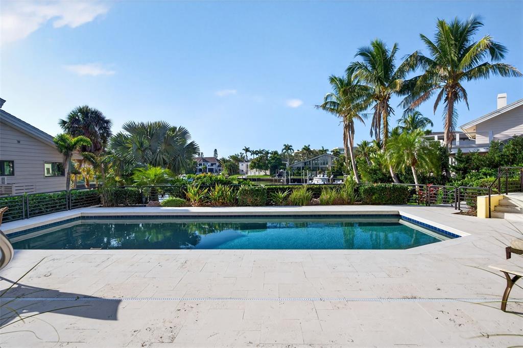 1571 Harbor Cay Lane Longboat Key, FL 34228 - Photo 60 of 93 a view of swimming pool with outdoor seating and plants