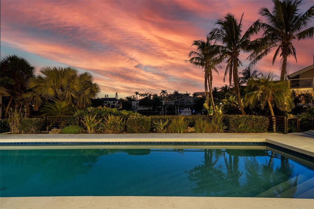 1571 Harbor Cay Lane Longboat Key, FL 34228 - Photo 61 of 93 a view of a yard with a house