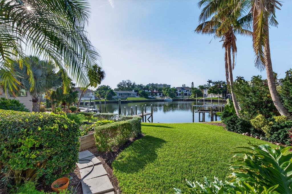 1571 Harbor Cay Lane Longboat Key, FL 34228 - Photo 62 of 93 a view of a lake with a garden